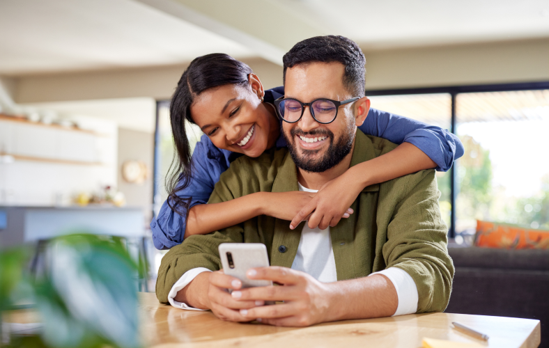 Husband and Wife looking at mobile phone